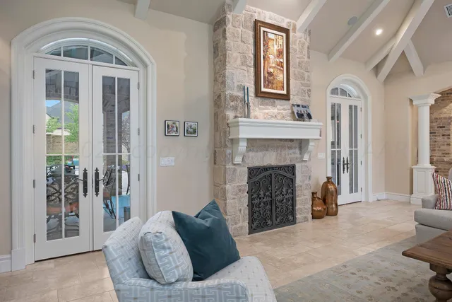 a bathroom with a granite countertop sink a mirror and shower