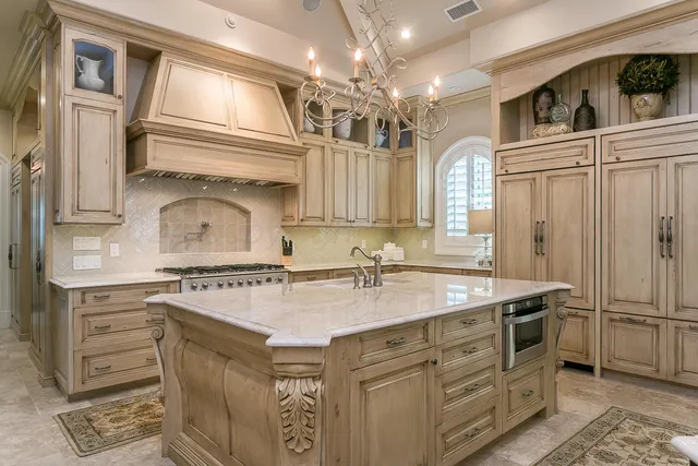 a view of a dining room with furniture a chandelier and wooden floor