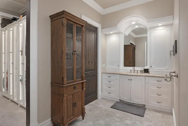a bathroom with a granite countertop sink a toilet and a mirror