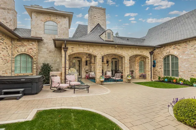 a view of a swimming pool with a patio