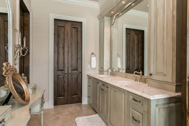 an aerial view of residential houses with outdoor space and parking