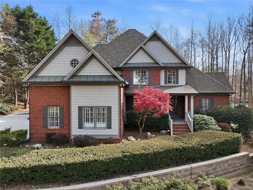 800 Barberry Drive Milton, GA 30004 - Photo 1 of 63 a front view of a house with garden
