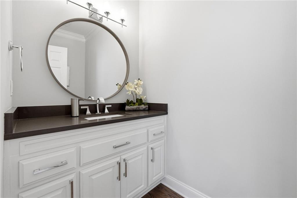 800 Barberry Drive Milton, GA 30004 - Photo 23 of 63 a bathroom with a sink and a mirror