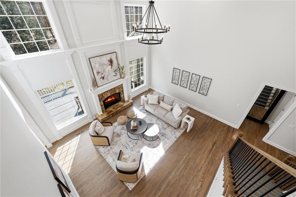 800 Barberry Drive Milton, GA 30004 - Photo 29 of 63 a view of a dining room with furniture a chandelier and wooden floor