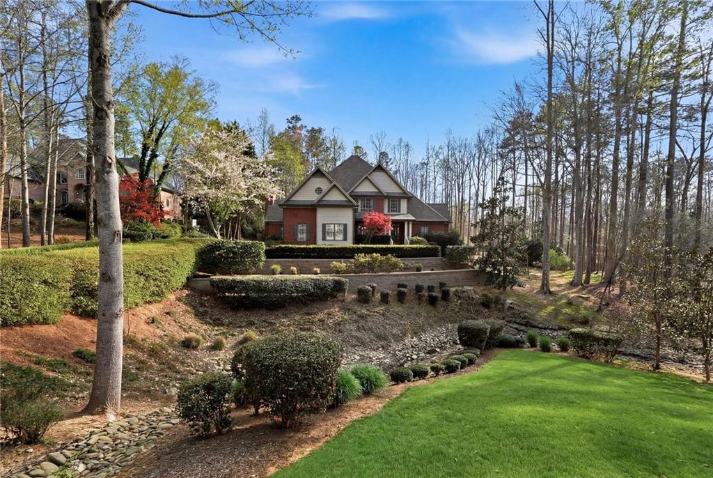 800 Barberry Drive Milton, GA 30004 - Photo 3 of 63 a front view of a house with a yard