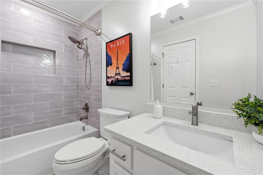800 Barberry Drive Milton, GA 30004 - Photo 31 of 63 a bathroom with a sink a toilet and shower