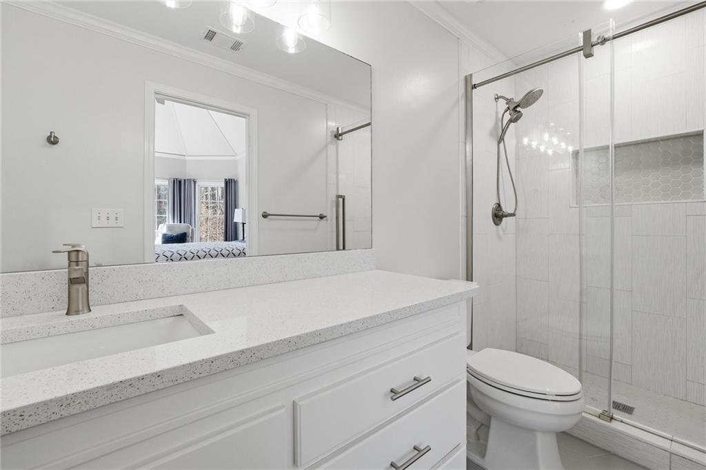 800 Barberry Drive Milton, GA 30004 - Photo 39 of 63 a bathroom with a sink a toilet and shower