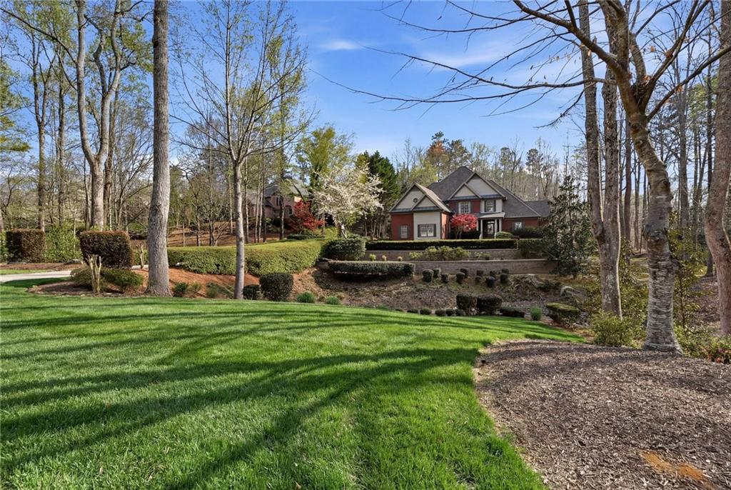 800 Barberry Drive Milton, GA 30004 - Photo 4 of 63 a view of a park with large trees