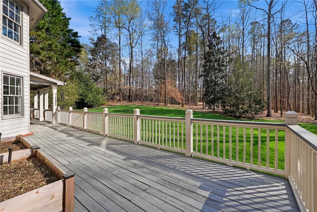 800 Barberry Drive Milton, GA 30004 - Photo 48 of 63 a view of deck with wooden floor and fence with trees
