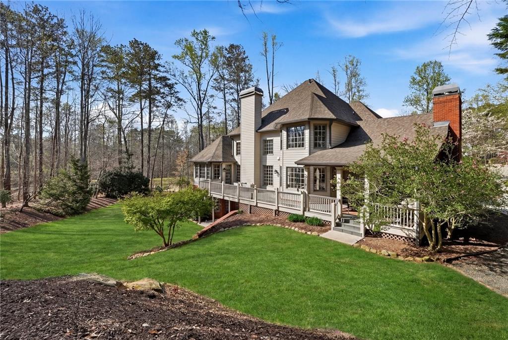 800 Barberry Drive Milton, GA 30004 - Photo 50 of 63 a view of a house with a yard and sitting area