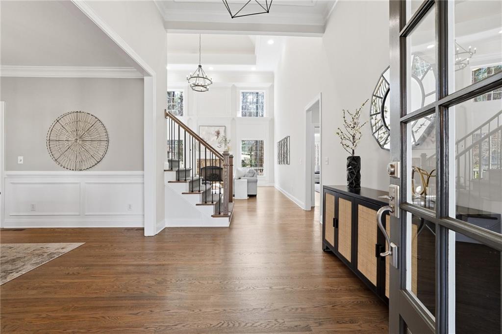 800 Barberry Drive Milton, GA 30004 - Photo 7 of 63 a view of a hallway with wooden floor and stairs