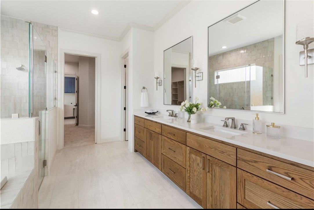 5102 Greenstone Way Bryan, TX 77802 - Photo 10 of 29 a bathroom with a double vanity sink mirror and shower