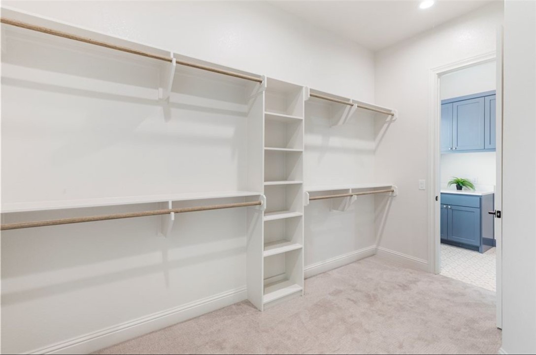 5102 Greenstone Way Bryan, TX 77802 - Photo 20 of 29 a view of walk in closet with empty racks