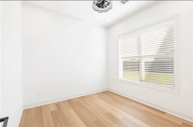 a view of cabinets a sink and a microwave in a shelf