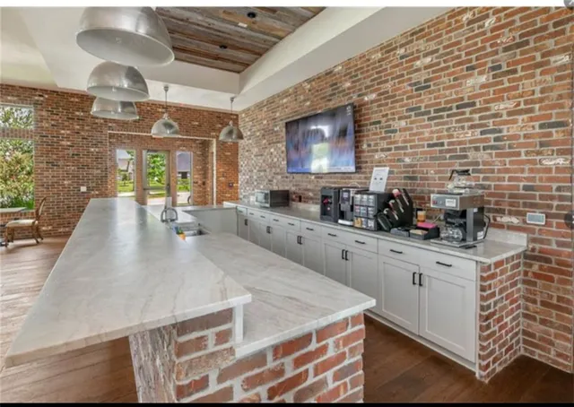 an aerial view of a house with a swimming pool yard and outdoor seating