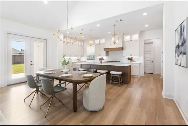 a view of house with swimming pool yard and outdoor seating