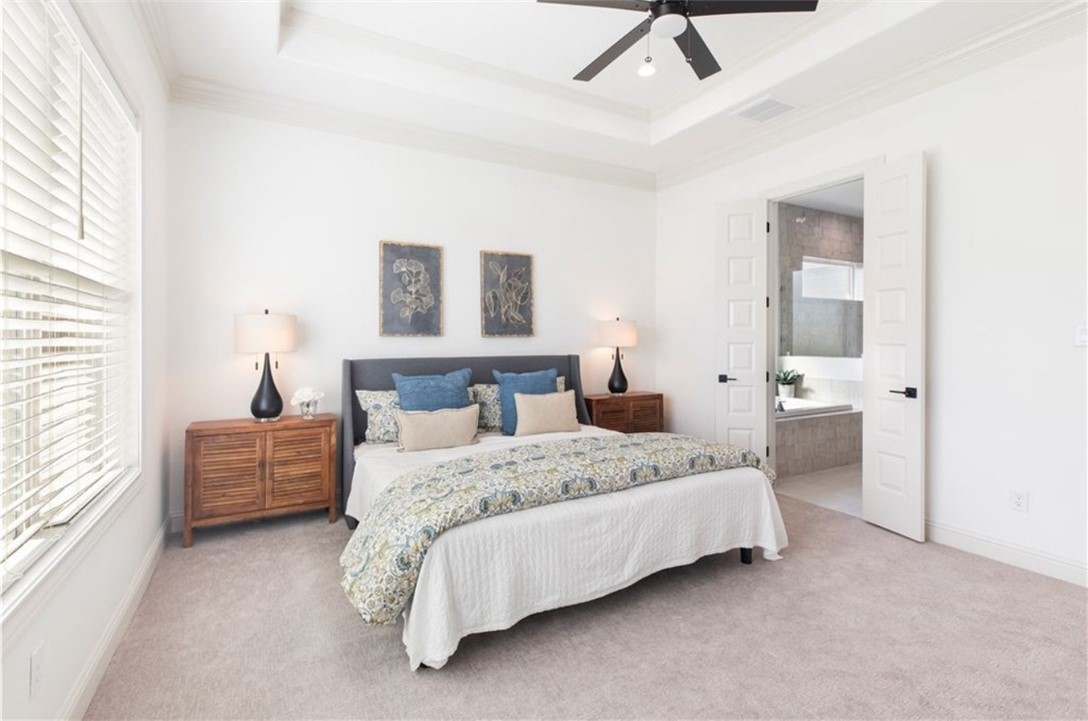 5102 Greenstone Way Bryan, TX 77802 - Photo 6 of 29 a bedroom with a bed and a couch