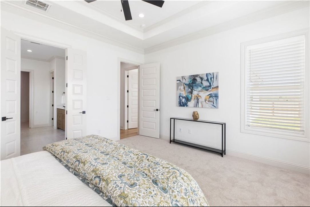 5102 Greenstone Way Bryan, TX 77802 - Photo 7 of 29 a bedroom with a bed and a dresser