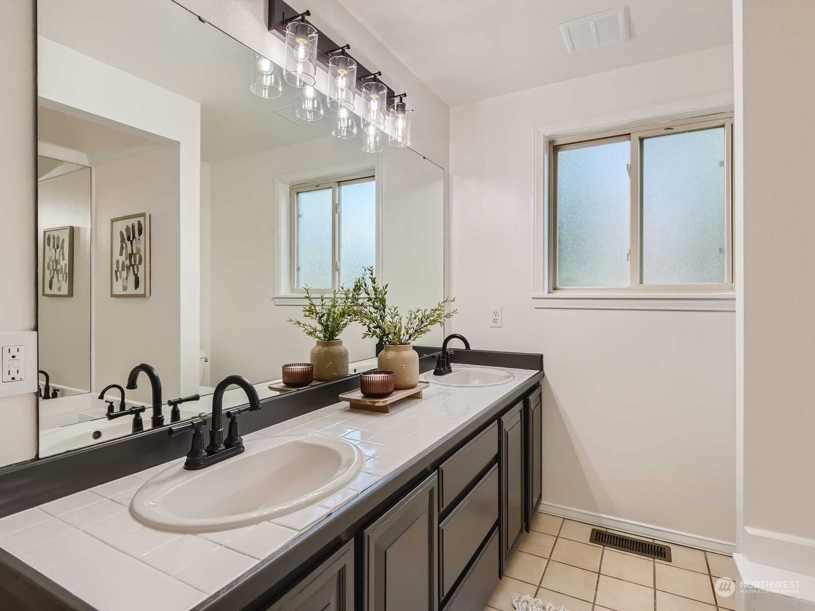 24207 15th Place Southeast Bothell, WA 98021 - Photo 14 of 27 a bathroom with a sink double vanity and a mirror