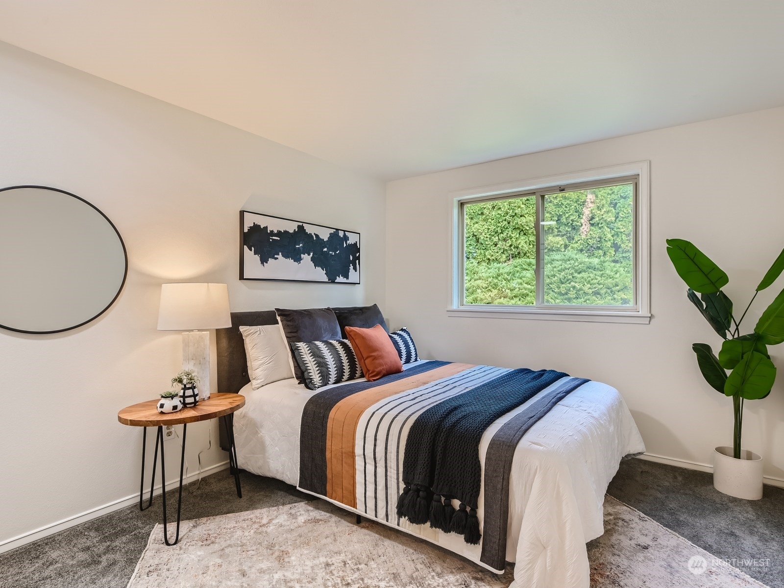 24207 15th Place Southeast Bothell, WA 98021 - Photo 17 of 27 a bed sitting in a bedroom next to a window