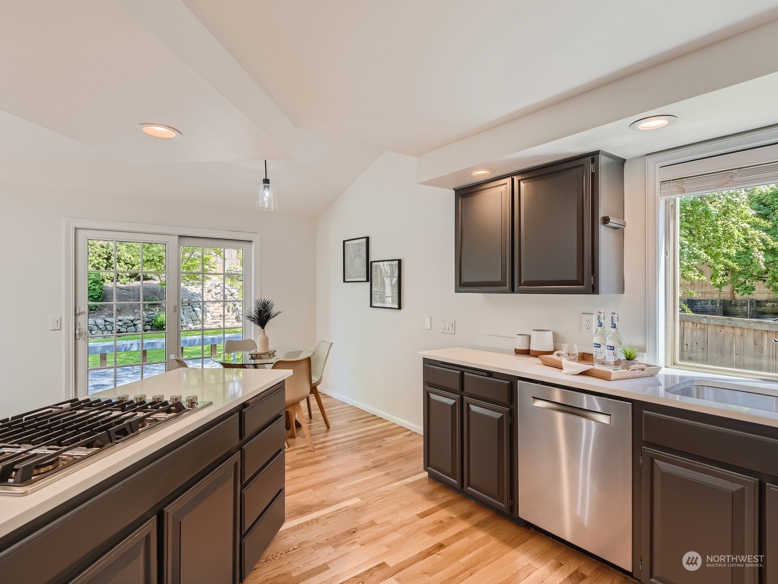 24207 15th Place Southeast Bothell, WA 98021 - Photo 7 of 27 a kitchen with granite countertop a sink stove and cabinets