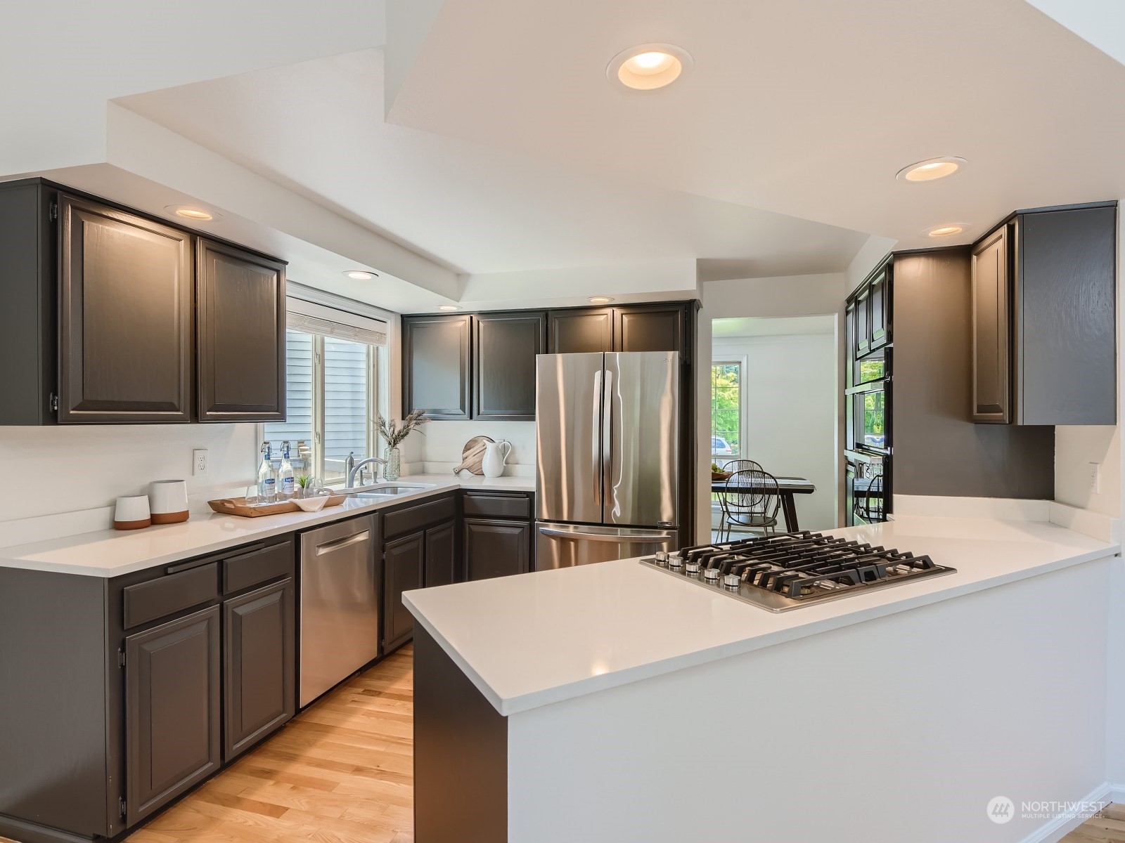 24207 15th Place Southeast Bothell, WA 98021 - Photo 8 of 27 a kitchen with a sink and refrigerator
