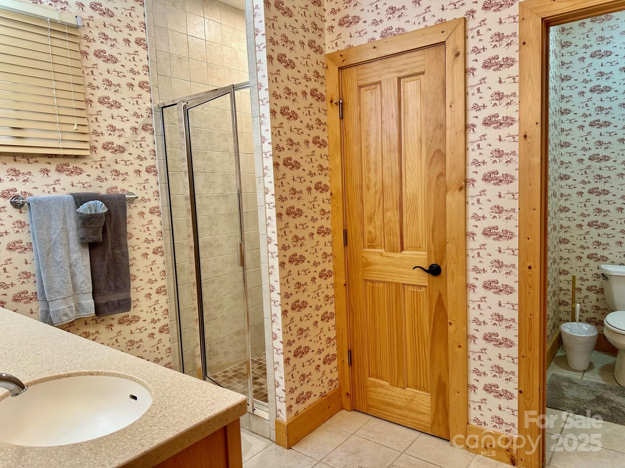 56 First Tee Trail Cashiers, NC 28717 - Photo 18 of 37 a bathroom with a sink and a mirror