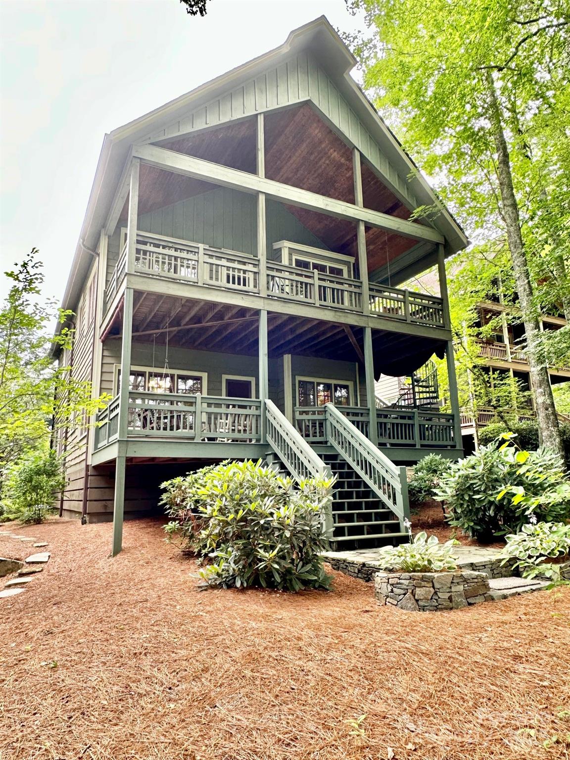 56 First Tee Trail Cashiers, NC 28717 - Photo 23 of 37 front view of a building with a street