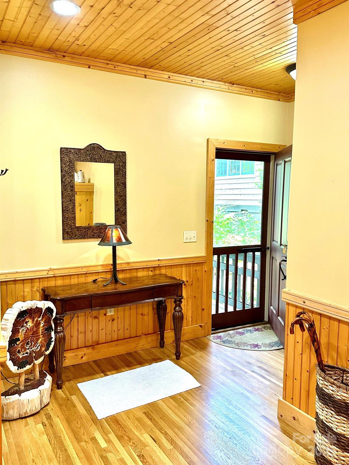 56 First Tee Trail Cashiers, NC 28717 - Photo 5 of 37 a bedroom with a bed and wooden floor