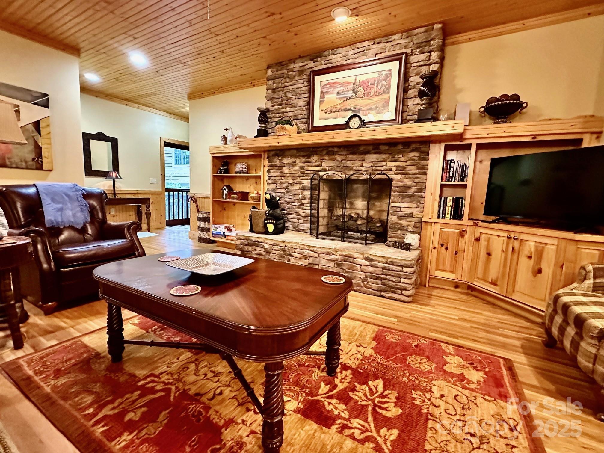 56 First Tee Trail Cashiers, NC 28717 - Photo 7 of 37 a living room with furniture and a fireplace
