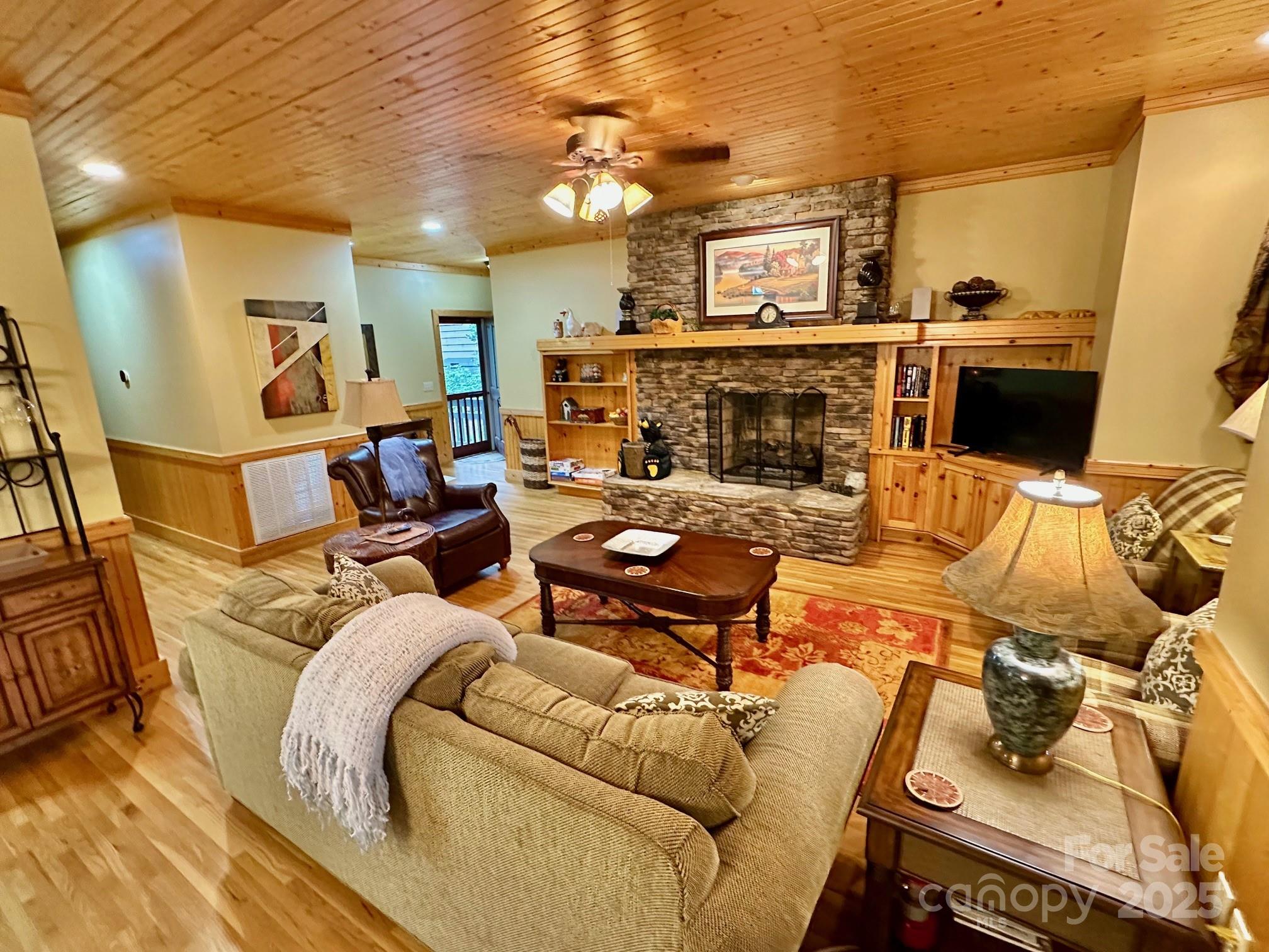 56 First Tee Trail Cashiers, NC 28717 - Photo 9 of 37 a living room with furniture and a fireplace