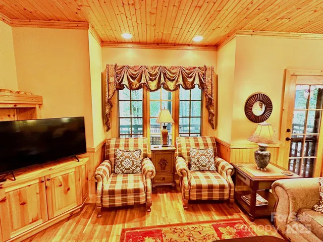 a kitchen with granite countertop a sink a stove and cabinets