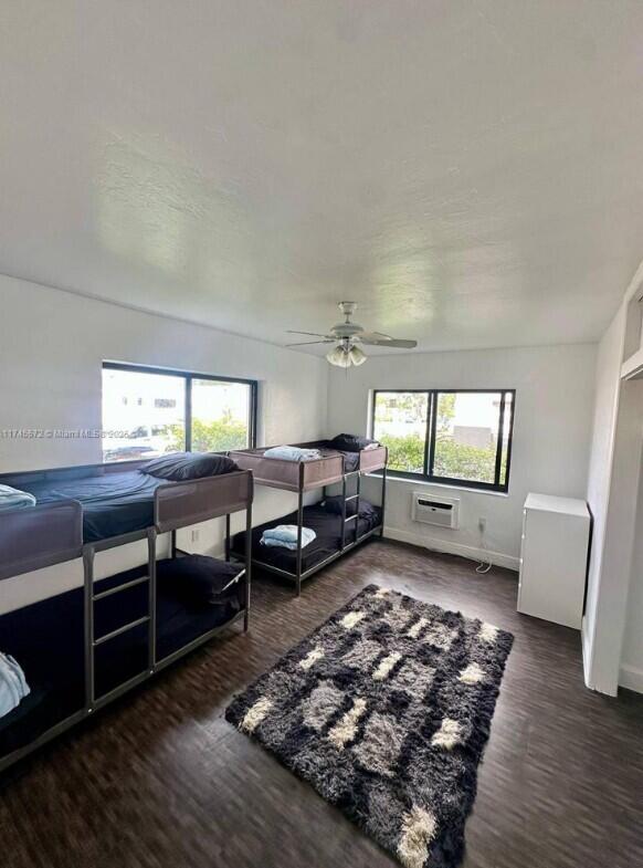 7035 Rue Granville Miami Beach, FL 33141 - Photo 9 of 12 a living room with furniture and a rug