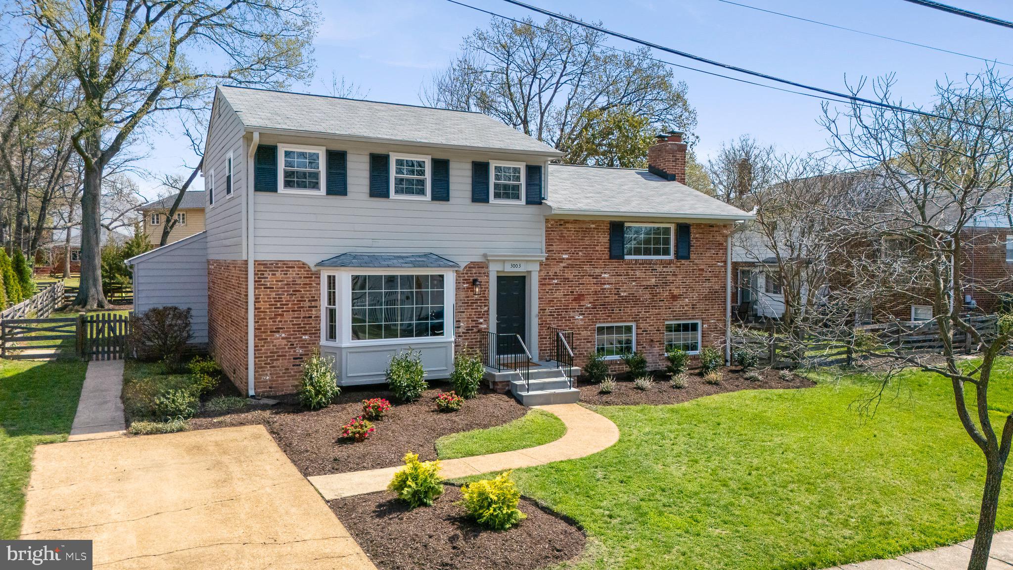 3003 Farm Road Alexandria, VA 22302 - Photo 1 of 49 a front view of a house with swimming pool table and chairs