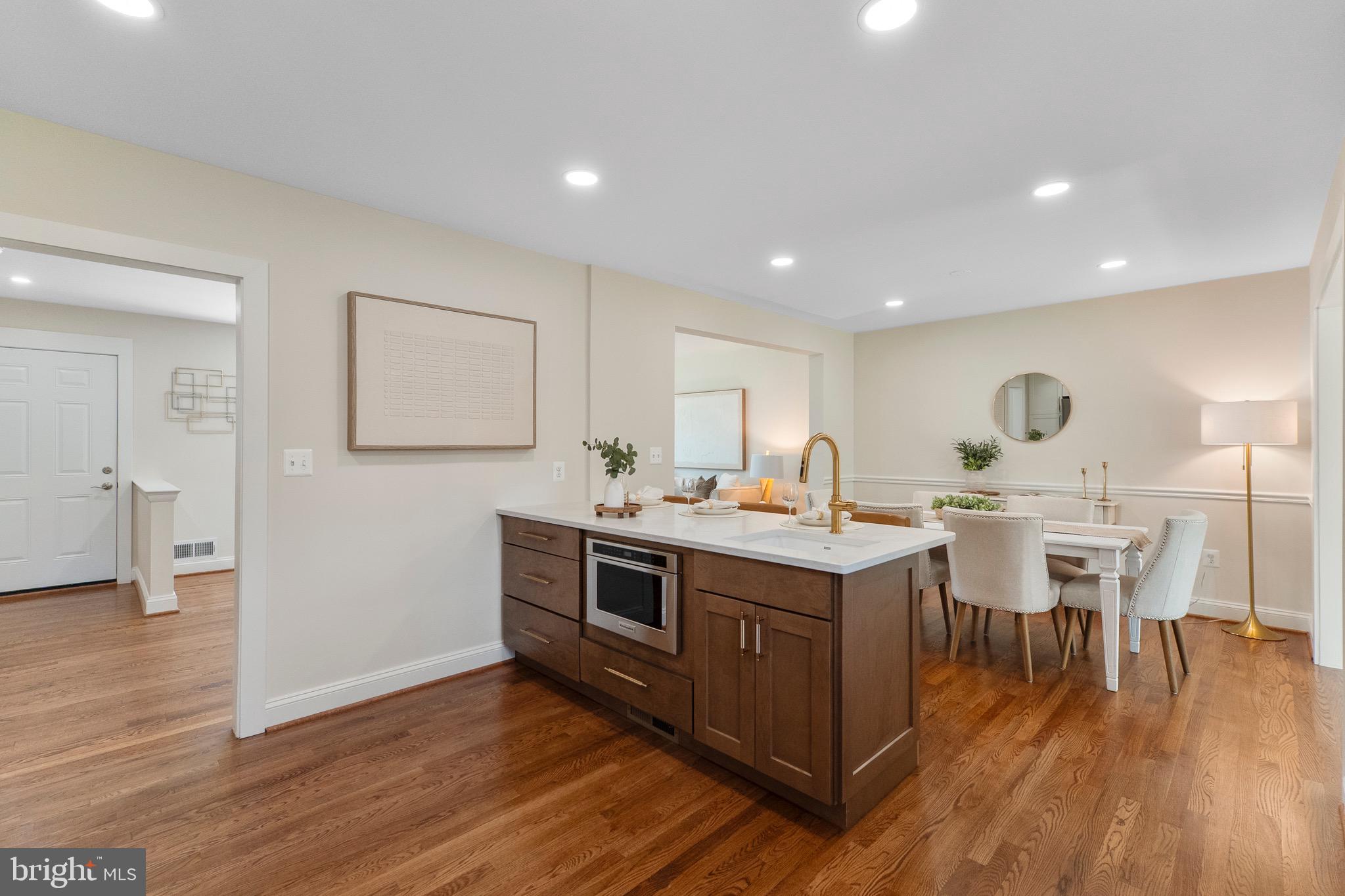 3003 Farm Road Alexandria, VA 22302 - Photo 13 of 49 a room with stainless steel appliances granite countertop a table chairs and a refrigerator