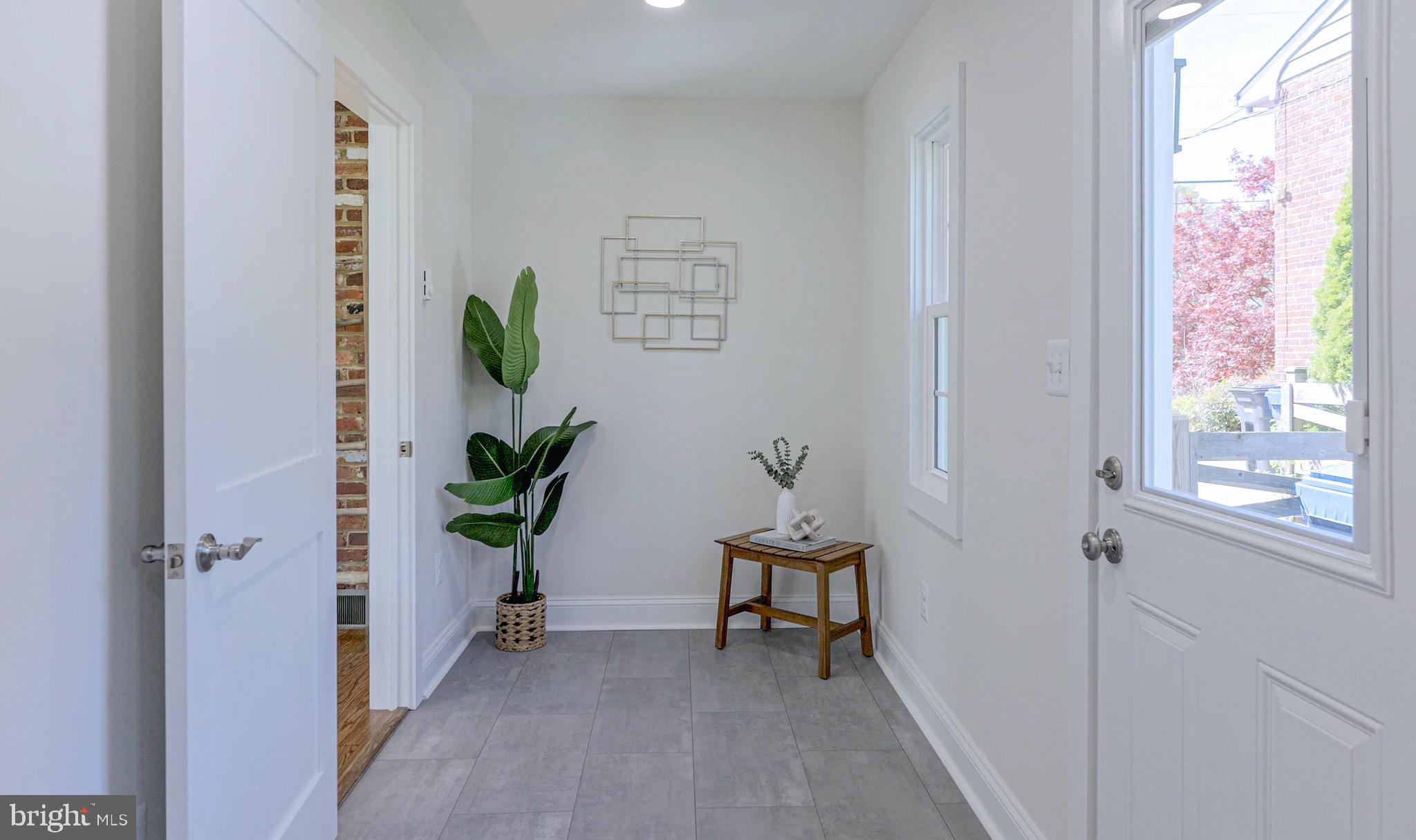 3003 Farm Road Alexandria, VA 22302 - Photo 19 of 49 a view of a hallway with paintings on the wall