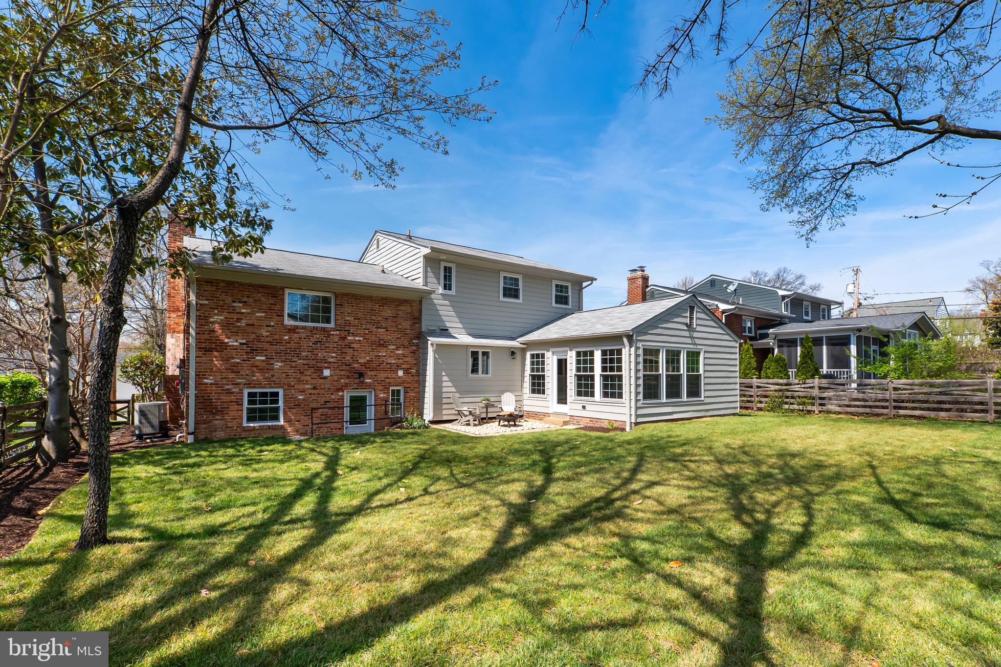 3003 Farm Road Alexandria, VA 22302 - Photo 2 of 49 a front view of a house with a yard table and chairs