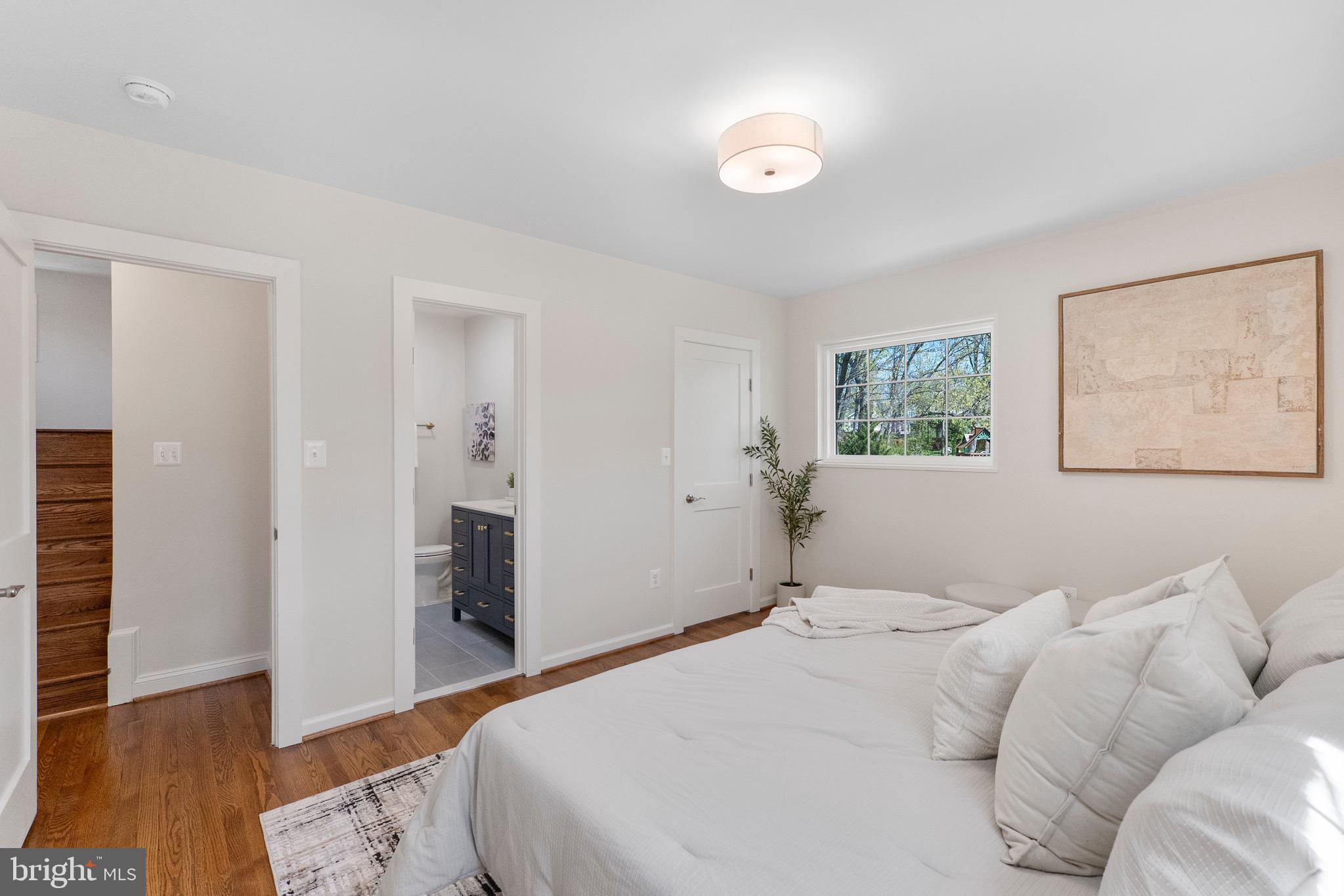 3003 Farm Road Alexandria, VA 22302 - Photo 23 of 49 a bedroom with a bed and a painting on the wall