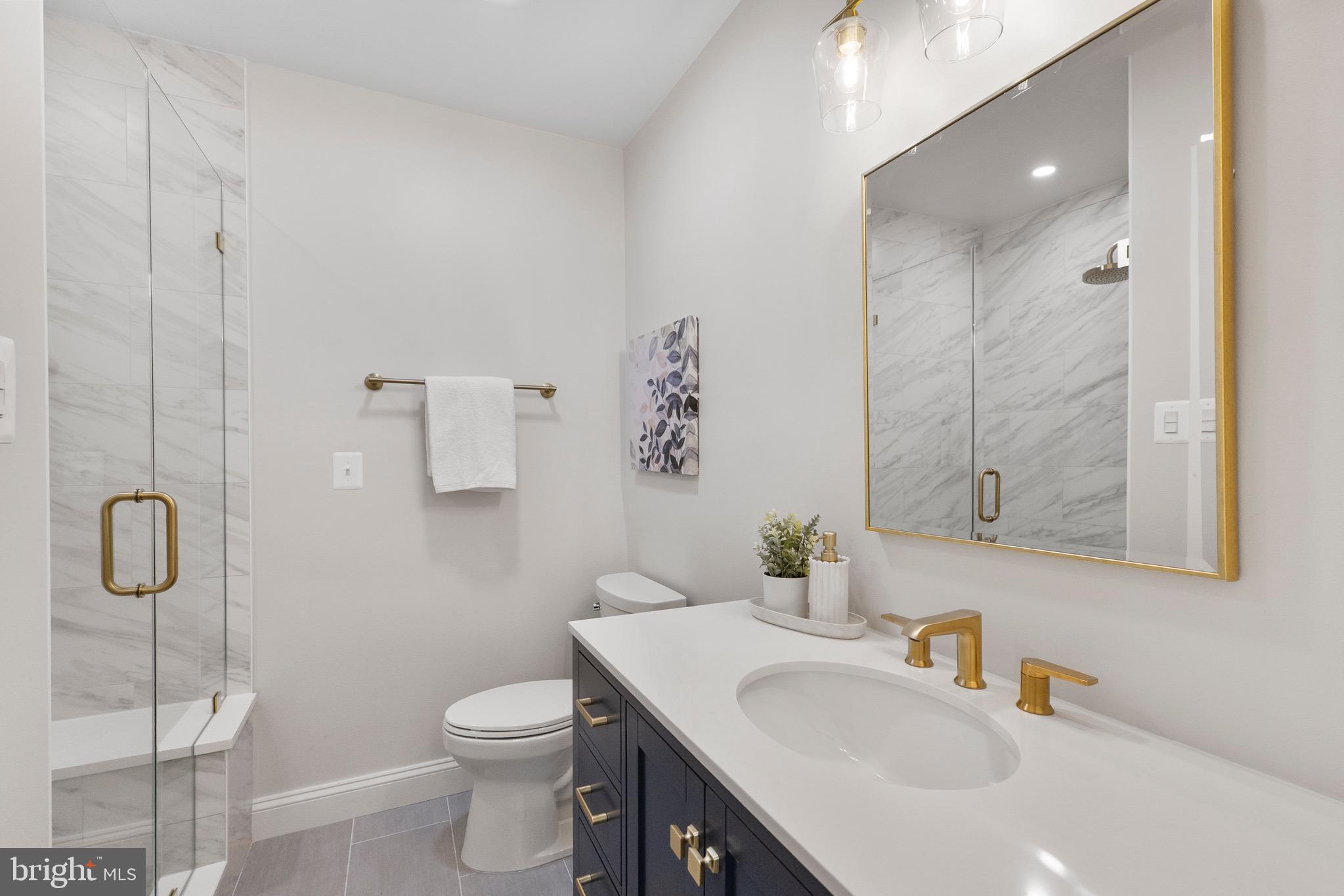 3003 Farm Road Alexandria, VA 22302 - Photo 24 of 49 a bathroom with a sink a toilet and shower