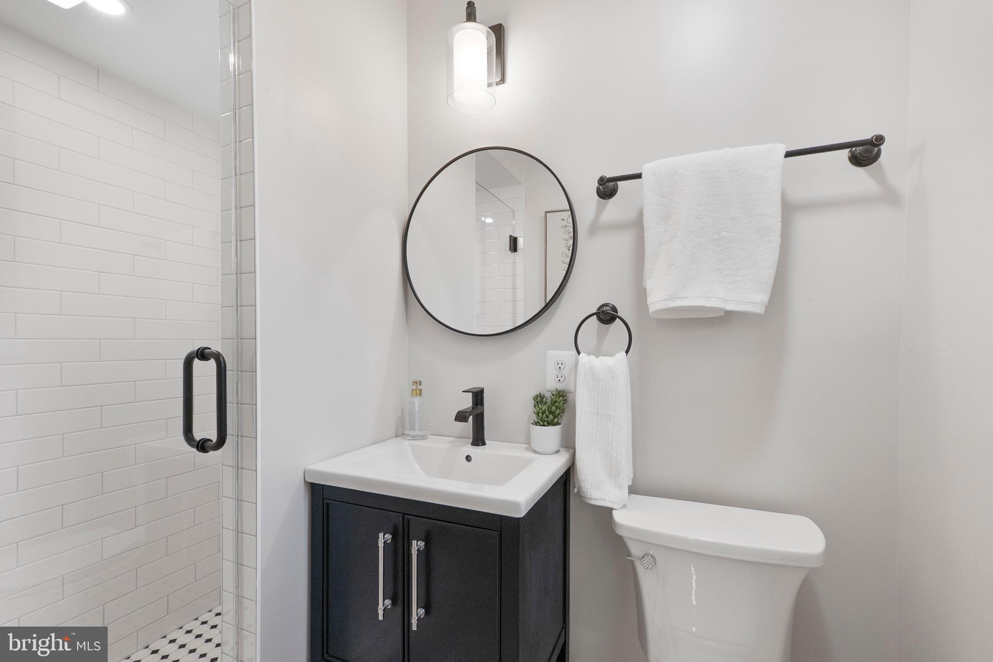 3003 Farm Road Alexandria, VA 22302 - Photo 29 of 49 a bathroom with a sink and a mirror