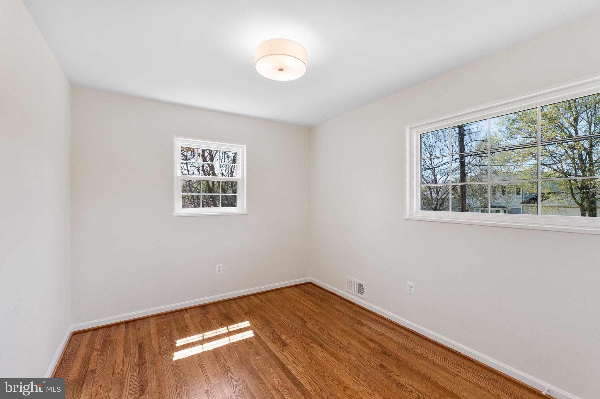 3003 Farm Road Alexandria, VA 22302 - Photo 30 of 49 a view of empty room with wooden floor and fan