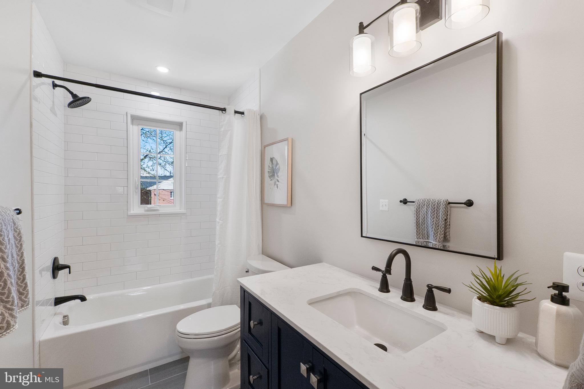 3003 Farm Road Alexandria, VA 22302 - Photo 32 of 49 a bathroom with a sink toilet and shower