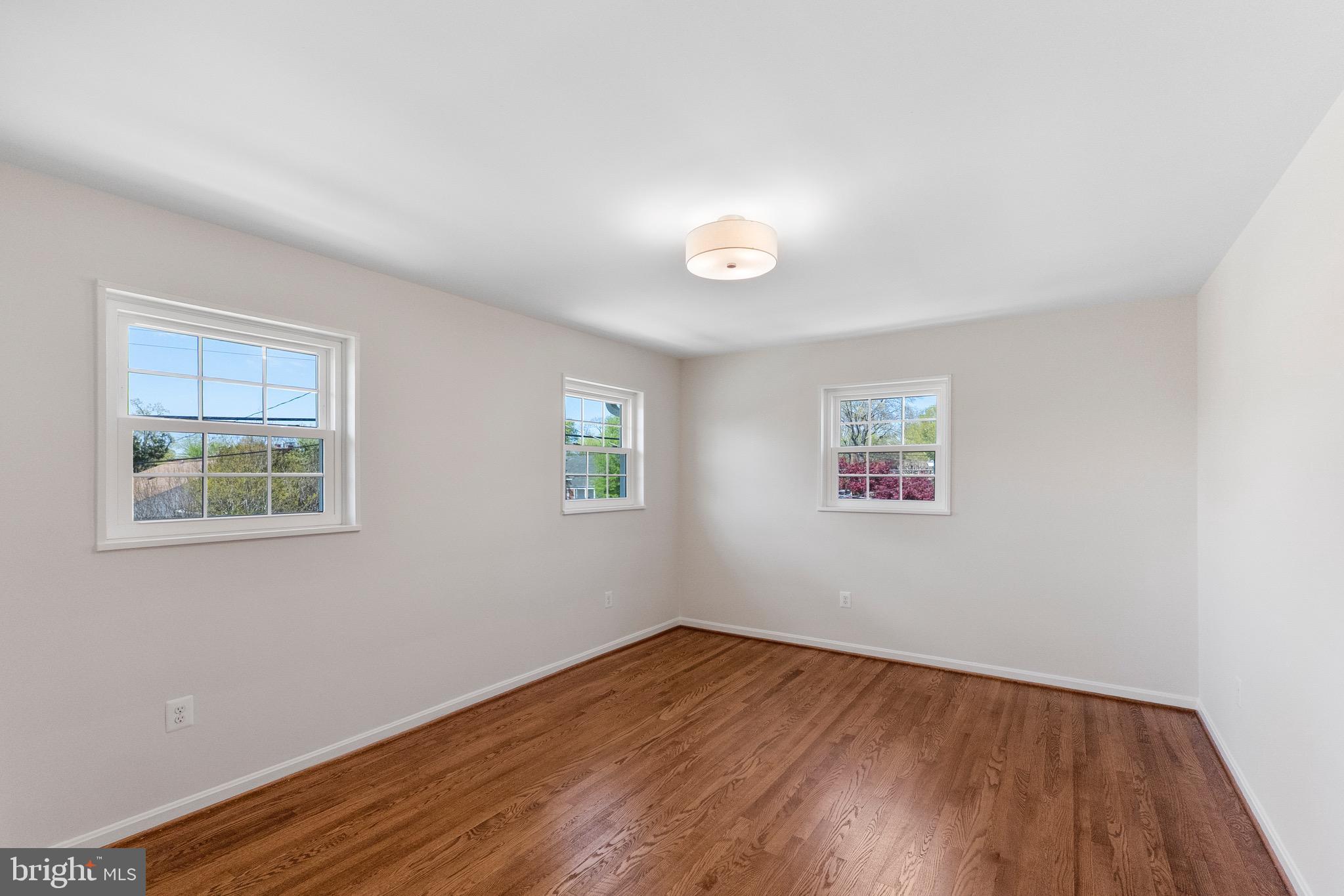 3003 Farm Road Alexandria, VA 22302 - Photo 33 of 49 an empty room with a hardwood and windows