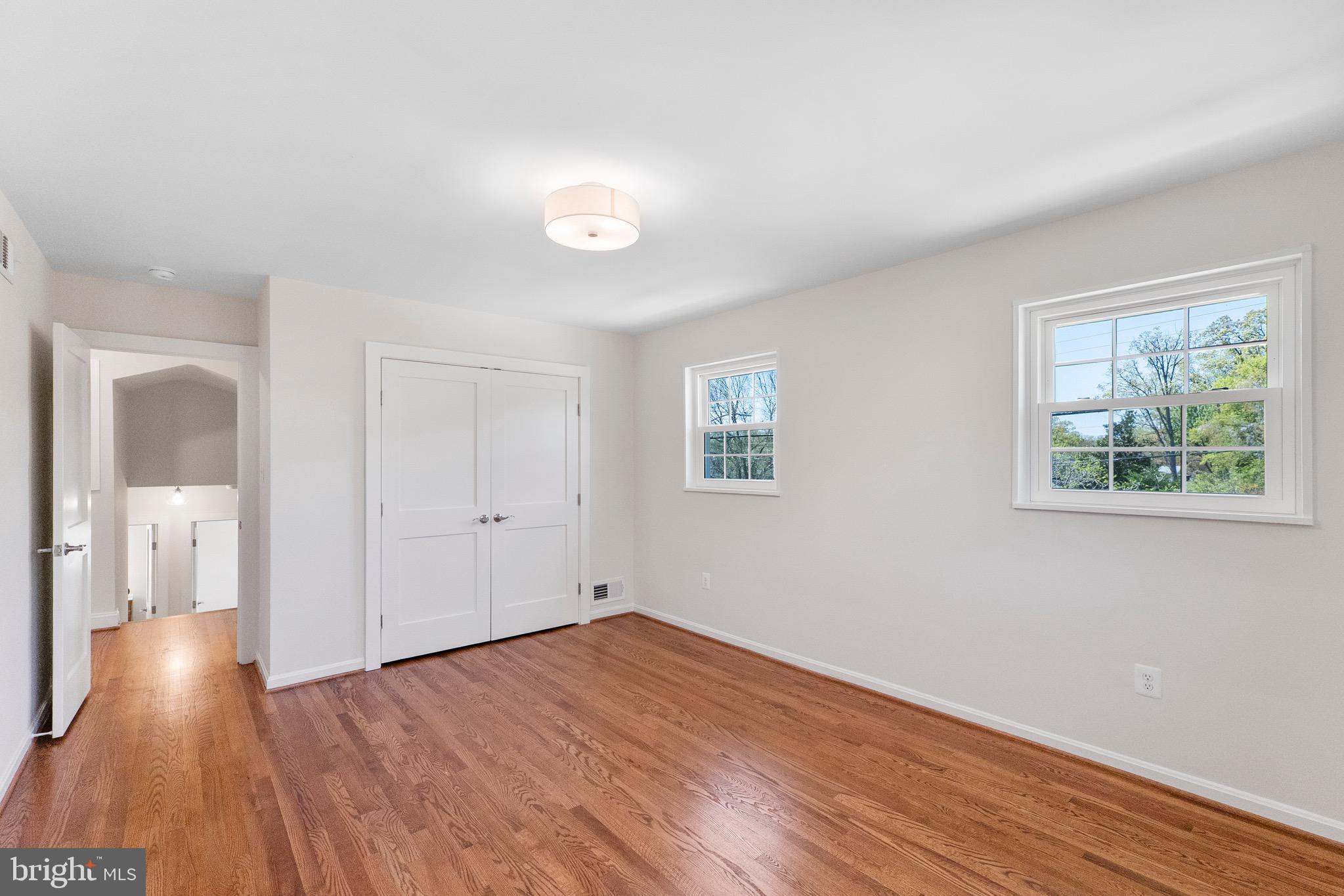 3003 Farm Road Alexandria, VA 22302 - Photo 34 of 49 an empty room with wooden floor and windows