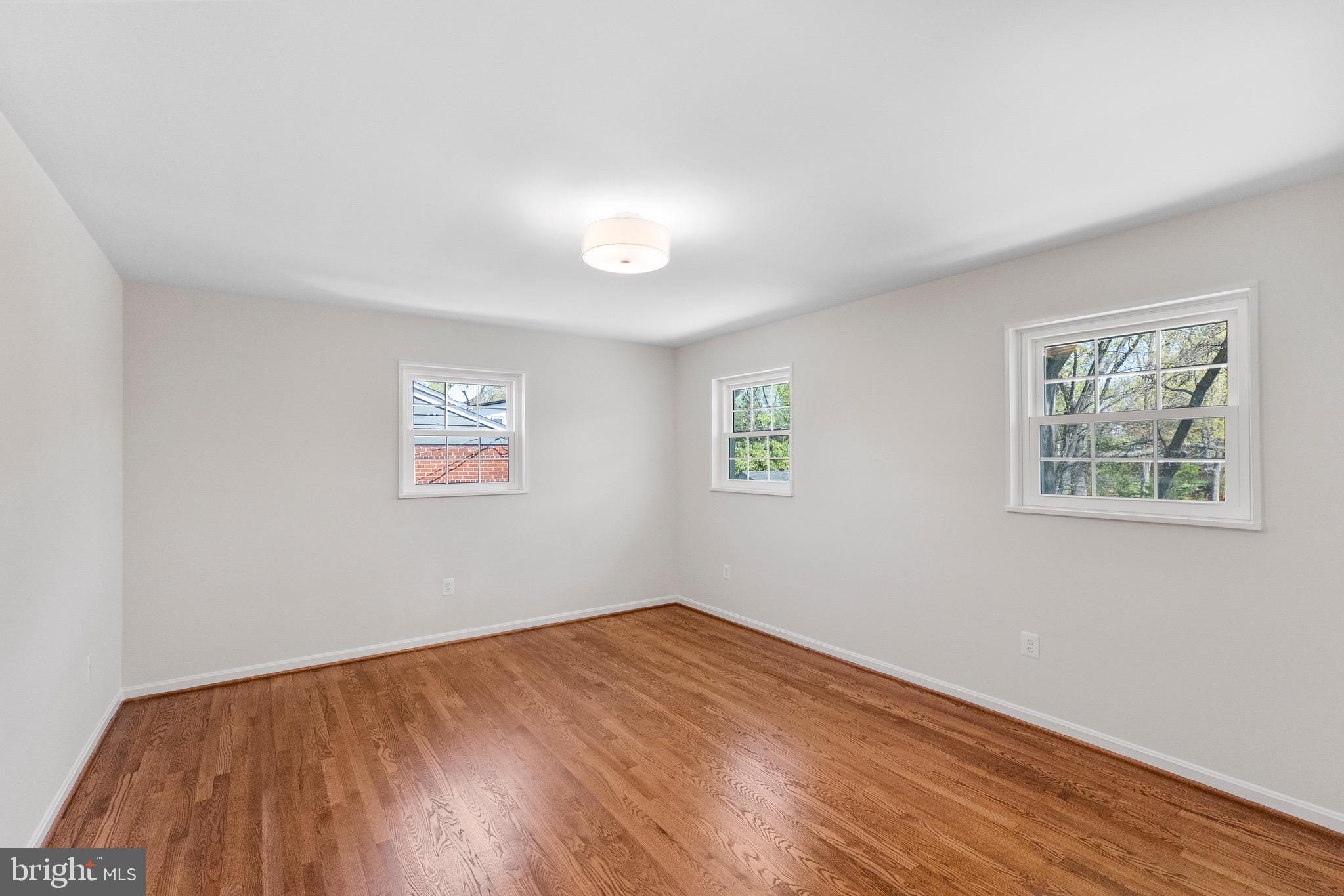 3003 Farm Road Alexandria, VA 22302 - Photo 36 of 49 a view of empty room with wooden floor and fan