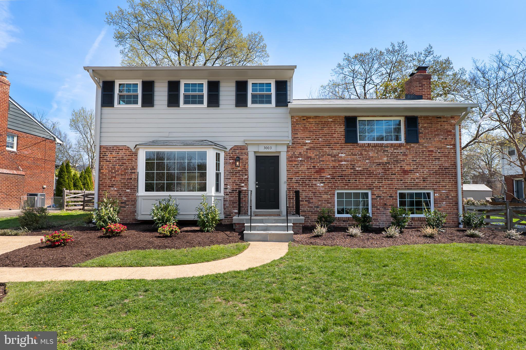 3003 Farm Road Alexandria, VA 22302 - Photo 48 of 49 a front view of a house with garden and porch