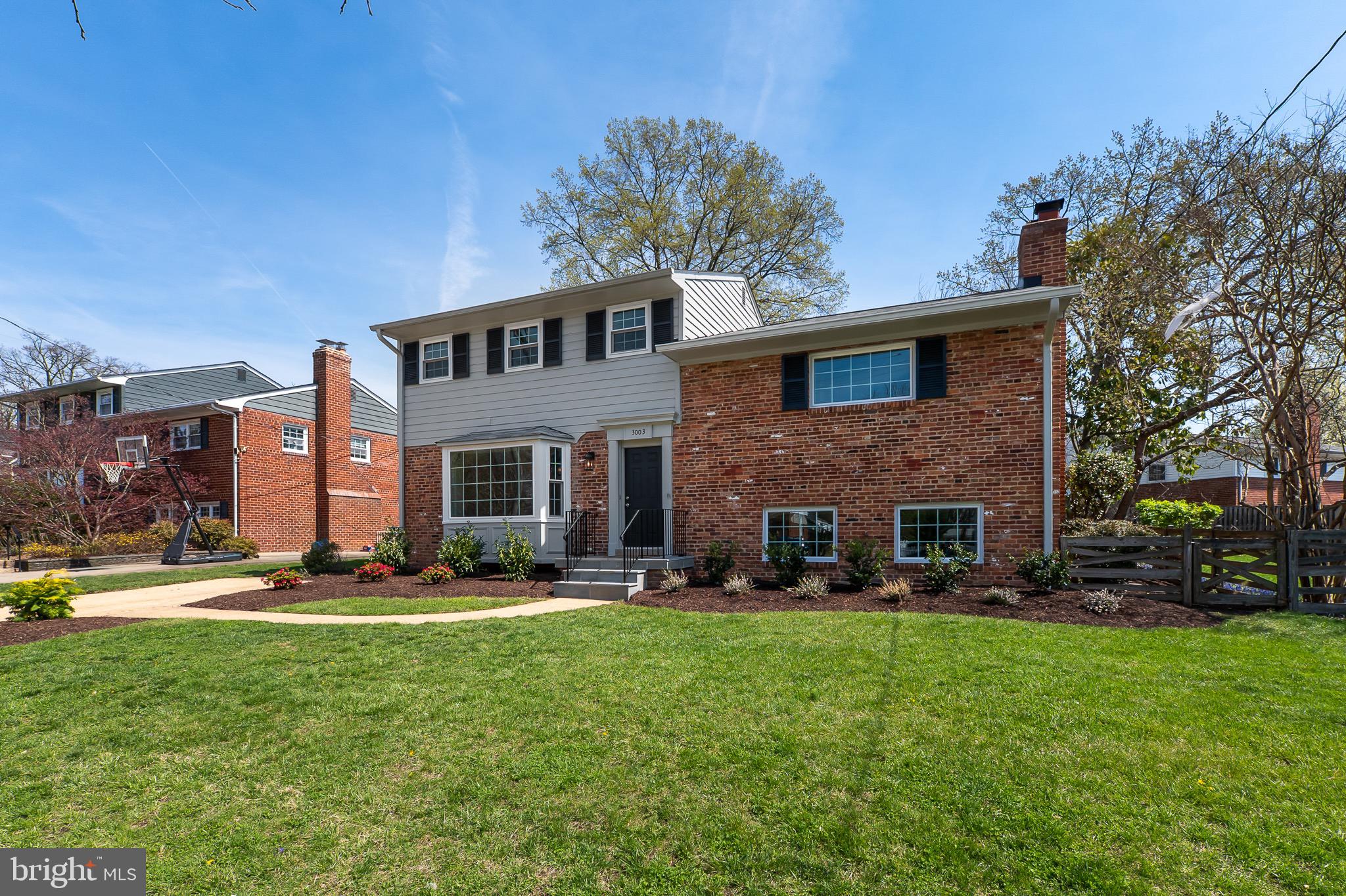 3003 Farm Road Alexandria, VA 22302 - Photo 49 of 49 a front view of a house with a yard fire pit and couches