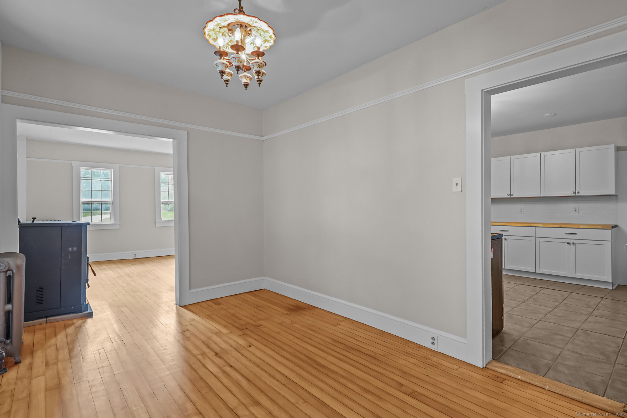 10 North Road Windham, CT 06280 - Photo 12 of 40 a view of a kitchen with wooden floor and a cabinet