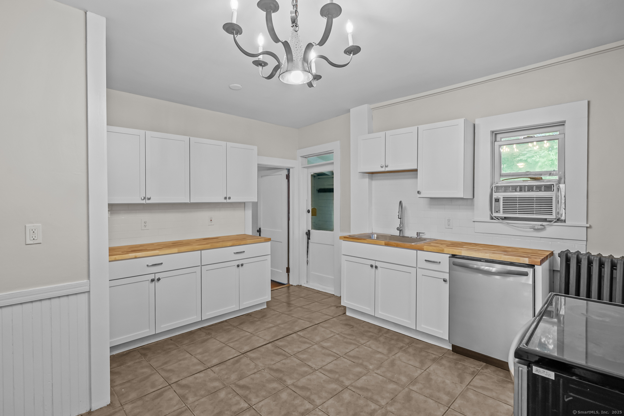 10 North Road Windham, CT 06280 - Photo 17 of 40 a large kitchen with a window and stainless steel appliances