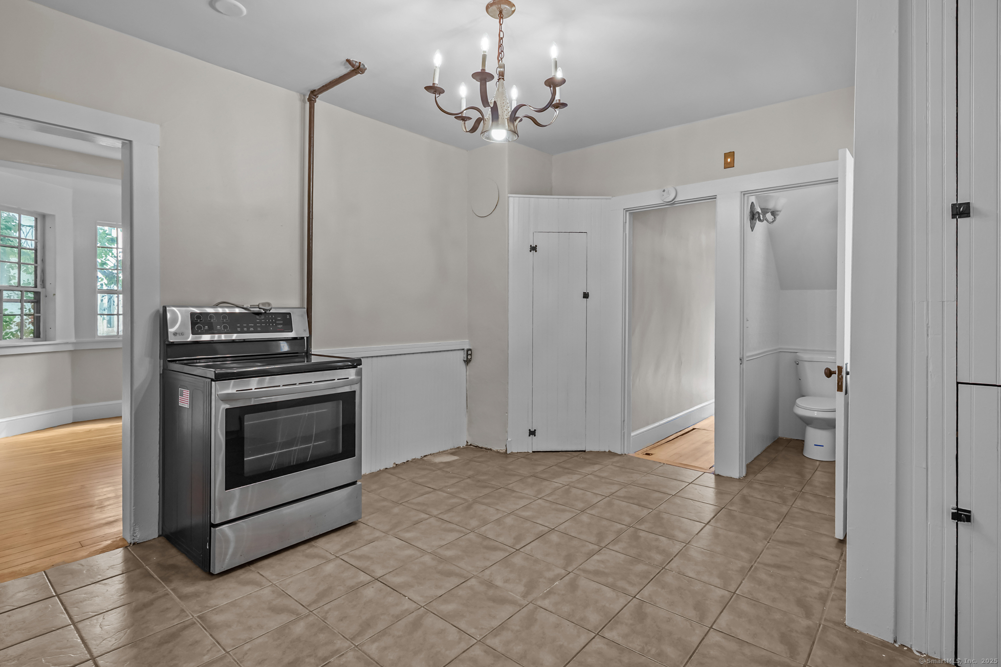 10 North Road Windham, CT 06280 - Photo 18 of 40 a view of a kitchen with a stove cabinets and a refrigerator